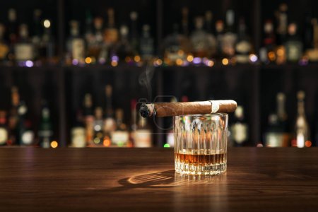 Photo for NO LOGOS OR TRADEMARKS!  SELF MADE LABELS! close up view of cigar and glass on color back. - Royalty Free Image
