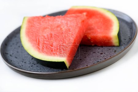 Photo for Pieces of watermelon on a plate - dietary come sweet - Royalty Free Image