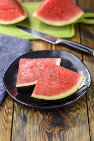 Photo for Pieces of watermelon on a plate - dietary come sweet - Royalty Free Image