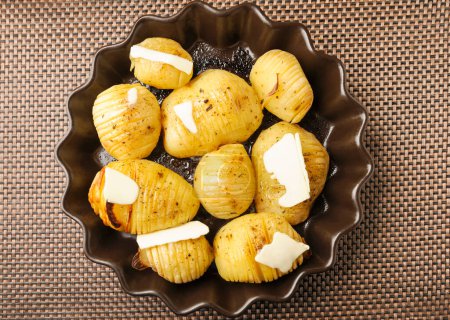 Hasselback baked potatoes with butter