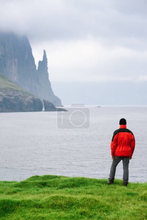 Photo for View of the Mountains and Rocks of Witches Finger Near the Village of Sandavagur on the Island of Vagar, Faroe Islands - Royalty Free Image