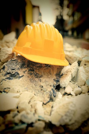 Photo for Yellow helmet at work place - Royalty Free Image