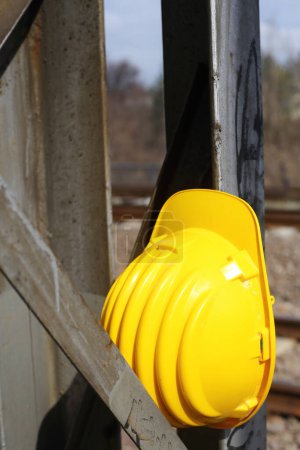 Photo for Safety first yellow helmet at the work place - Royalty Free Image