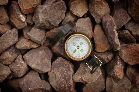 Photo for A compass on large stones - Royalty Free Image