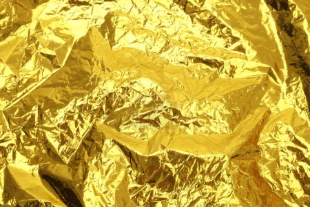 Photo for Gold and bronze glitter foil crumpled paper. Abstract glow shine texture copy space background. - Royalty Free Image