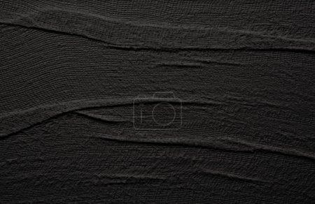 Empty crumpled wet black canvas blank texture copy space wall horizontal background.