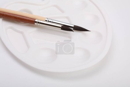 Photo for Paint brushes and white palette. - Royalty Free Image
