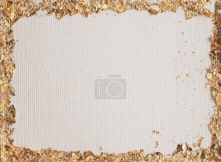 Foto de Gold (bronze) glitter empty frame beige gray paper canvas background. Abstract copy space texture. - Imagen libre de derechos