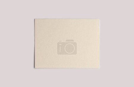 Téléchargez les photos : Empty canvas frame on beige gray paper background. Abstract copy space texture. - en image libre de droit