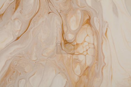 Foto de Art Abstract flow pour acrylic and watercolor marble blot painting wall. Color wave beige and gold horizontal texture background. - Imagen libre de derechos