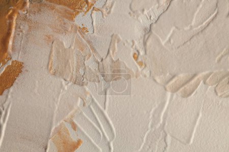 Photo for Stucco oil and acrylic smear blot canvas painting wall. Abstract texture pastel gold, beige color stain brushstroke texture background. - Royalty Free Image