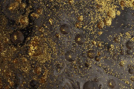 Foto de Flow pour oil and acrylic color painting blot. Abstract black and gold glitter texture background. - Imagen libre de derechos