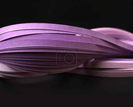 Foto de Violet color strip wave curve paper line. Abstract texture black space background. - Imagen libre de derechos