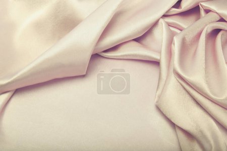 Foto de Beige gold pearl wave fabric silk. Abstract curtain texture copy space background. - Imagen libre de derechos