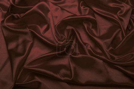 Téléchargez les photos : Tissu vague nacre marron soie. Texture abstraite espace de copie horizontal arrière-plan. - en image libre de droit