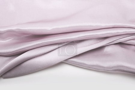 Foto de Seda de tela de onda de nácar de plata rosa. Textura abstracta horizontal copia espacio fondo. - Imagen libre de derechos