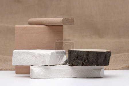 Photo for Stack stones and wood platform podium on canvas copy space background. Minimal empty display product presentation scene. - Royalty Free Image