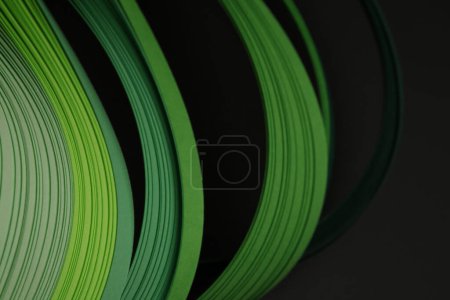 Photo for Green color strip wave paper. Abstract texture black background. - Royalty Free Image