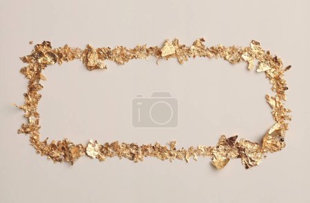 Photo for Gold (bronze) glitter empty canvas frame on beige gray paper background. Abstract copy space texture. - Royalty Free Image