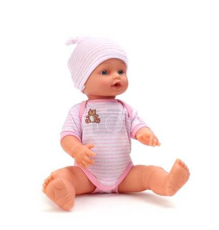 Photo for Toy baby doll in pink clothes and hat on white. - Royalty Free Image