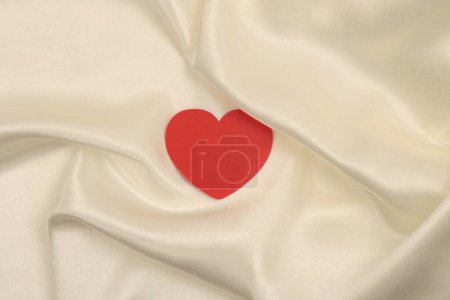 Photo for Beige white pearl wave silk fabric with heart frame card. Abstract texture copy space background. - Royalty Free Image