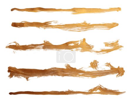 Foto de Grunge Gold tinta color mancha cepillo trazo mancha línea blot sobre fondo blanco. - Imagen libre de derechos