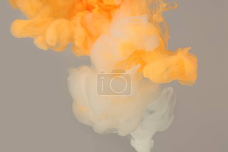 Photo for Abstract smoke background. Ink colors blot in water. Yellow, white, beige tone. - Royalty Free Image