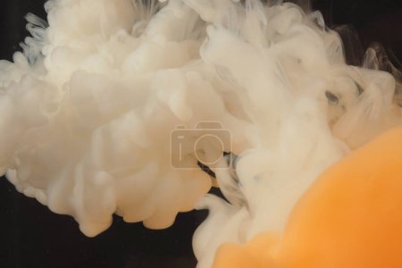 Photo for Abstract smoke background. Ink colors blot in water. Yellow, orange, white, black tone. - Royalty Free Image