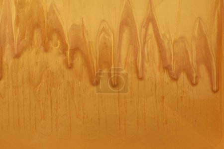Photo for Gold and bronze glitter color flow liquid painting wall background. - Royalty Free Image
