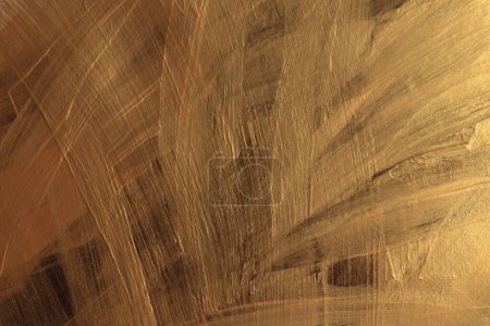 Foto de Brillo de oro tinta frotis cepillo trazo mancha blot brillo textura pared fondo. - Imagen libre de derechos