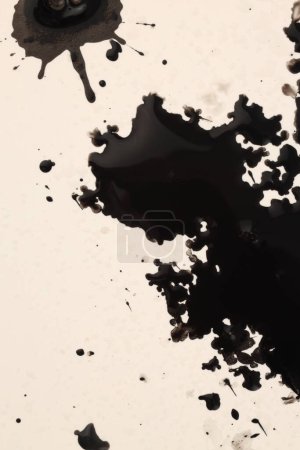 Photo for Black Ink watercolor spray blot on beige paper background. - Royalty Free Image
