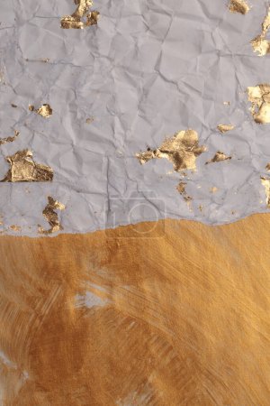 Photo for Crumble Paper texture painting glow glitter blot wall. Abstract gold, bronze and beige stain copy space background. - Royalty Free Image