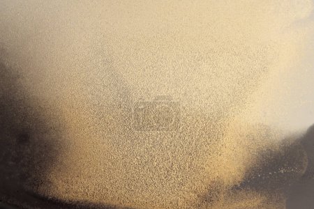 Photo for Grain blot painting stucco wall. Abstract texture gold color stain background. - Royalty Free Image