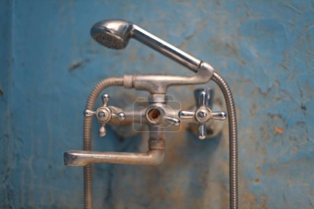 Photo for Soft focus Old vintage dirty water tap in broken bathroom. Trash repairs. Grunge wall background. - Royalty Free Image