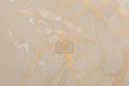 Photo for Gold glitter Ink watercolor drop blot on beige paper texture background. - Royalty Free Image