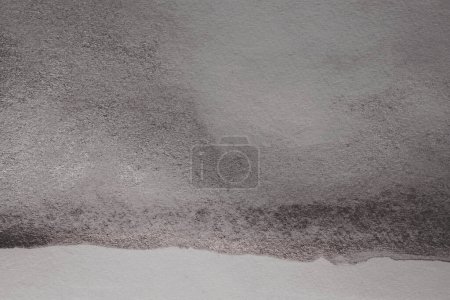 Photo for Black glitter Ink watercolor grain blot on gray paper texture background. - Royalty Free Image