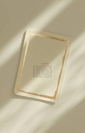 Photo for Empty Blank texture canvas paper card with gold frame. Light and shadows minimalism style template beige background. - Royalty Free Image