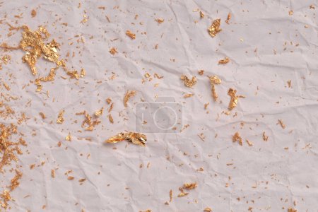 Photo for Crumble Paper texture painting glow glitter blot wall. Abstract gold, nacre and beige stain copy space background. - Royalty Free Image