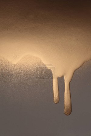 Photo for Gold and bronze glitter color flow liquid painting background. - Royalty Free Image