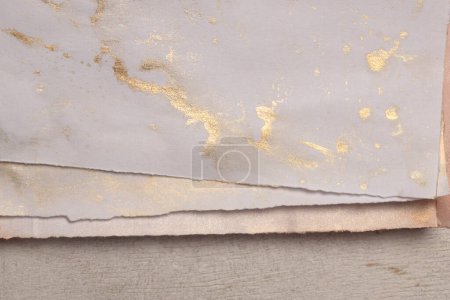 Photo for Beige and nacre gold  frame watercolor painting paper empty card blank on wood wall. Abstract texture copy space neutral grunge background. - Royalty Free Image