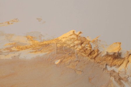 Photo for Art oil and acrylic smear blot canvas painting stucco wall. Abstract gold, beige color stain brushstroke modeling clay relief grain texture background. - Royalty Free Image