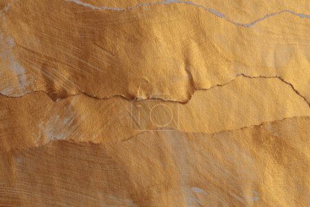 Photo for Gold, bronze crumble torn paper painting wall. Abstract glow texture copy space relief background. - Royalty Free Image