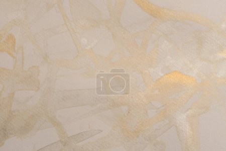 Photo for Gold, silver nacre glitter Ink watercolor line blot on beige paper texture grain background - Royalty Free Image