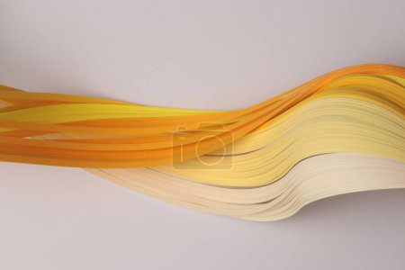 Foto de Papel ondulado de degradado de tira de color amarillo anaranjado sobre beige gris. Fondo de textura abstracta. - Imagen libre de derechos