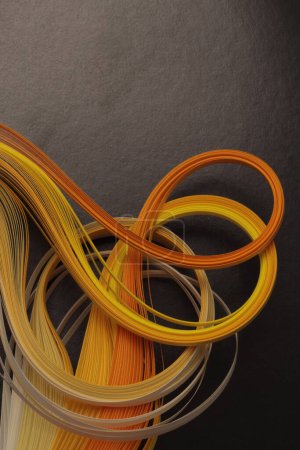 Foto de Papel de curva de onda de degradado de tira de color amarillo, naranja y negro. Fondo de textura abstracta. - Imagen libre de derechos