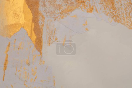 Gold, bronze and beige paper collage paper frame wall. Abstract glow texture copy space blank background.