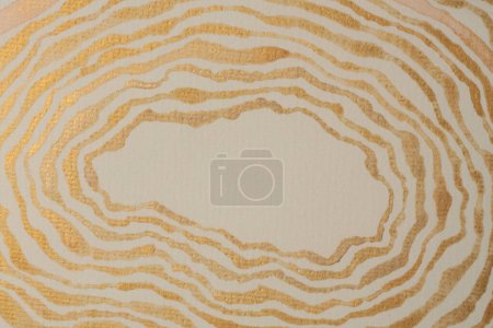 Photo for Gold bronze glitter ink watercolor wave line strip stain blot on beige grain paper texture background. - Royalty Free Image