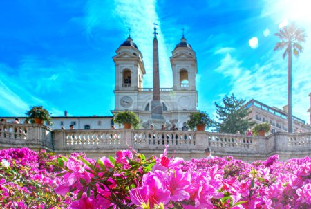 Rome, Italy, azalea flowers on the Spanish steps with the church in the background