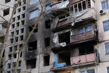 Photo for After bombing. War in Ukraine. Russian terrorists destroyed by shell dwelling house on Obolon district in Kyiv city on March 2022. Russia - terrorist country - Royalty Free Image