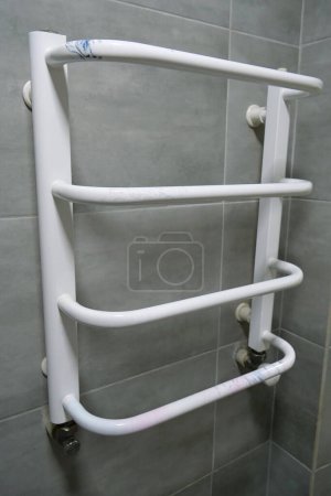 Photo for Heated towel rail in bathroom - Royalty Free Image
